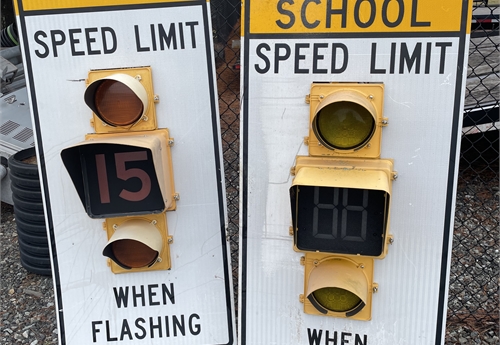 5 School speed limit flashers and 1 street crossing pole