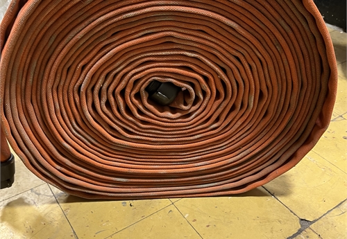 1-100 foot section of orange colored fire hose 1.5 inch diameter